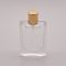 50 ml płaska szklana butelka perfum z małą złotą nasadką